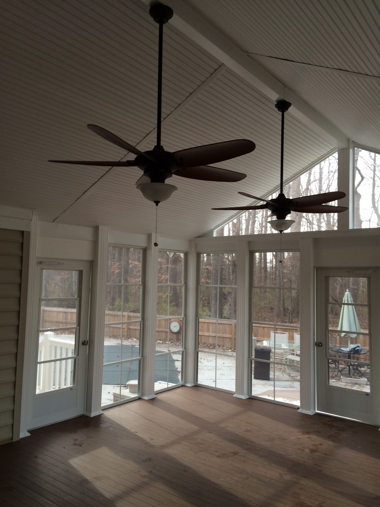 Sun room porch with ceiling fans